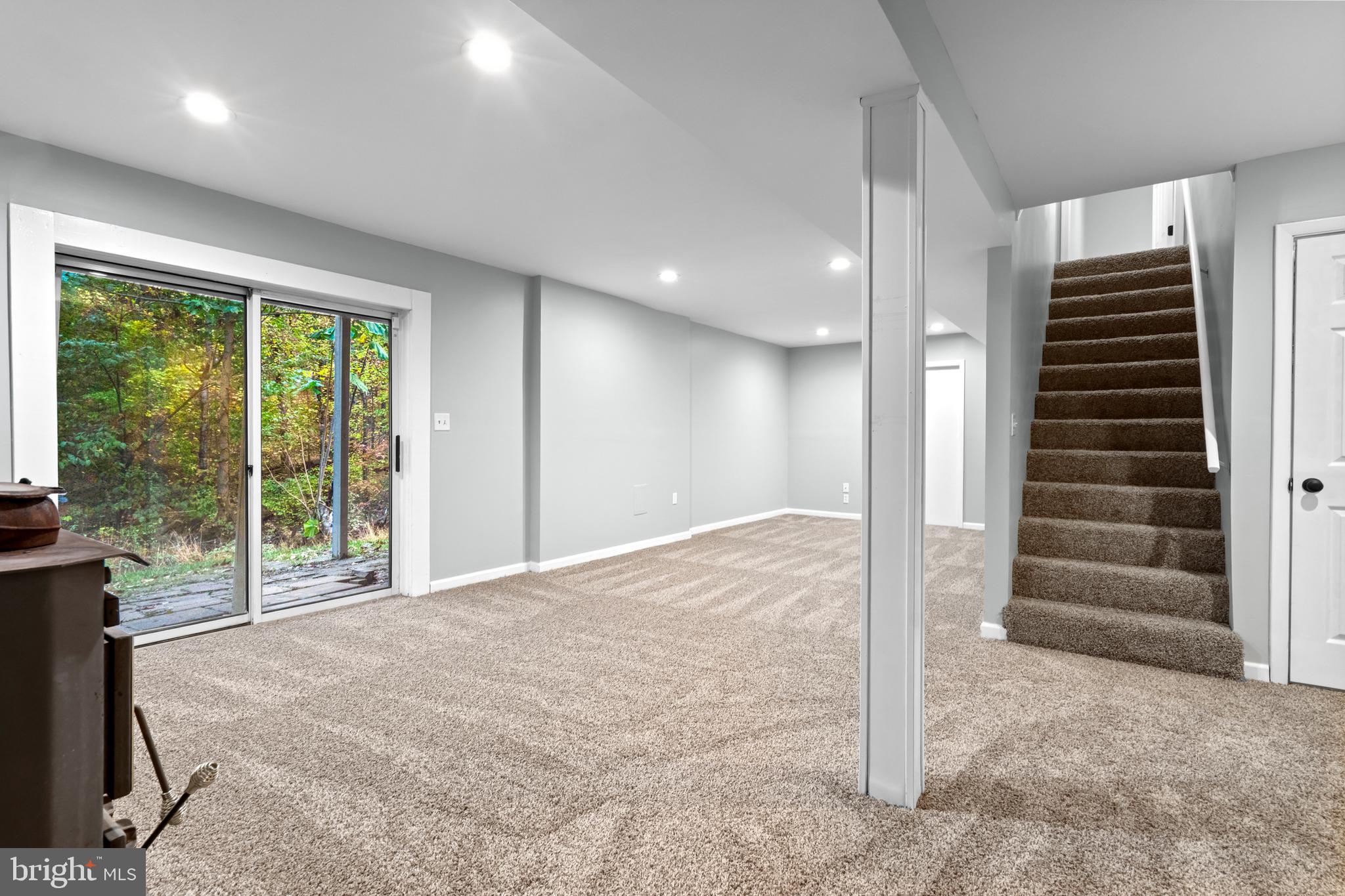 369 Wild Hare Road Harpers Ferry, WV 25425 - Photo 23 of 29 a view of an empty room with stairs and balcony view