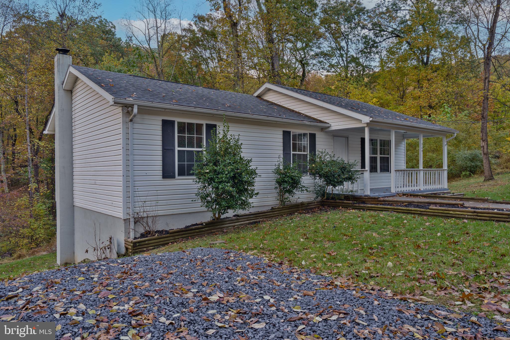 369 Wild Hare Road Harpers Ferry, WV 25425 - Photo 3 of 29 a backyard of a house with seating space