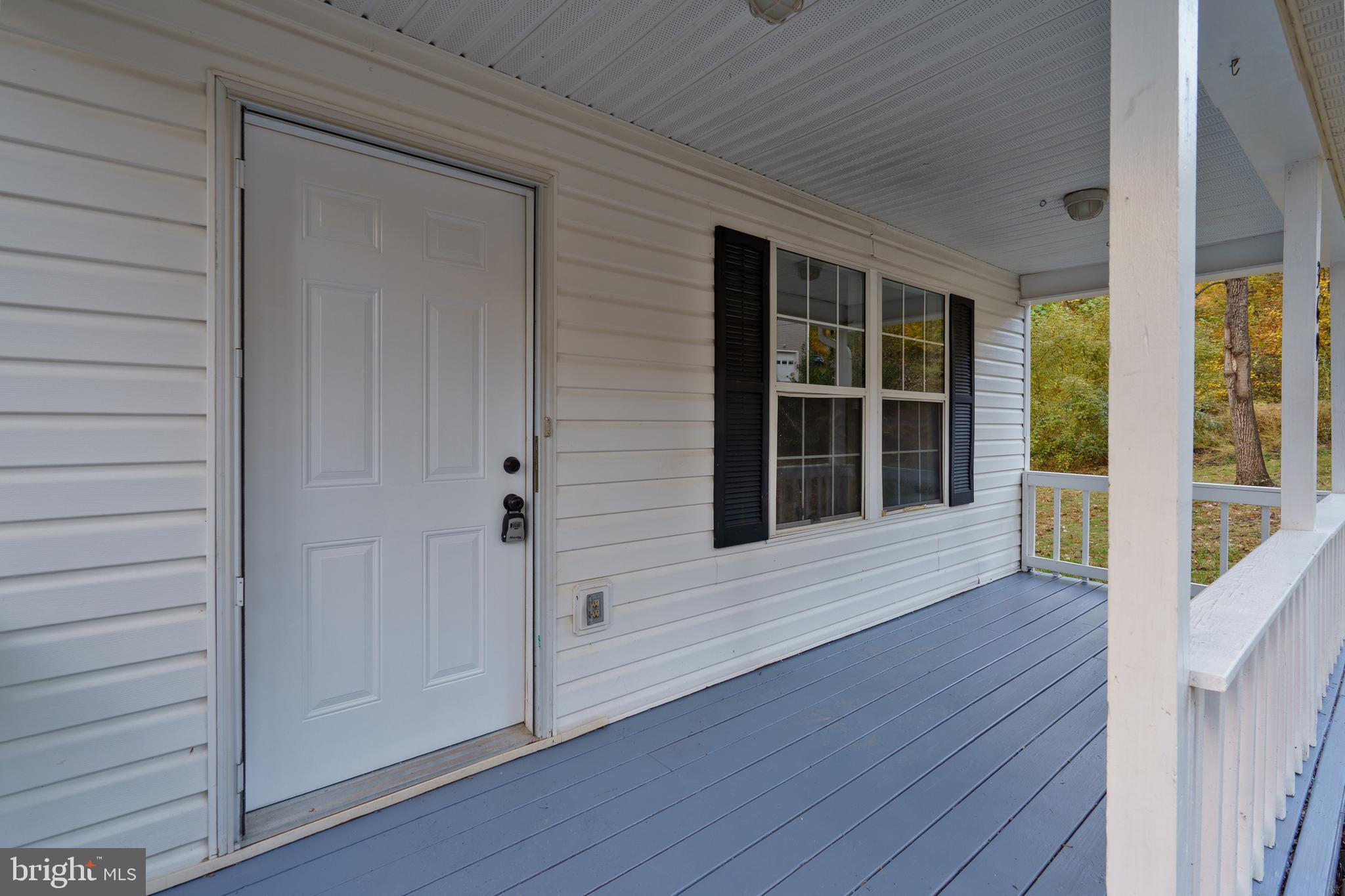 369 Wild Hare Road Harpers Ferry, WV 25425 - Photo 4 of 29 a view of front door with wooden floor