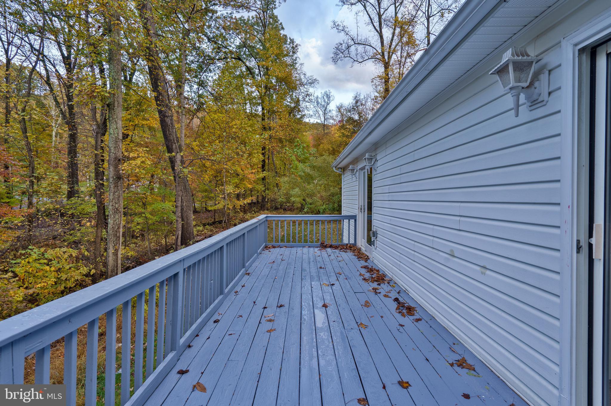 369 Wild Hare Road Harpers Ferry, WV 25425 - Photo 6 of 29 a view of deck in front of house with wooden floor