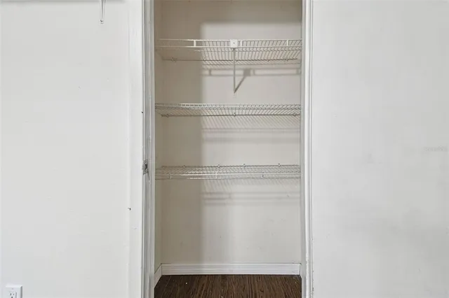 a small yard with a car parked in front of it