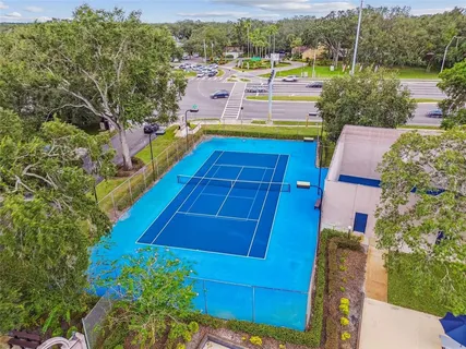 an aerial view of a house with swimming pool garden and patio