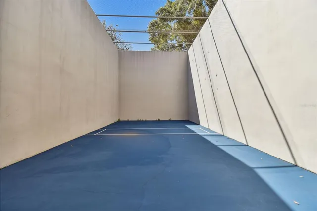 a view of a swimming pool with sitting area and garden
