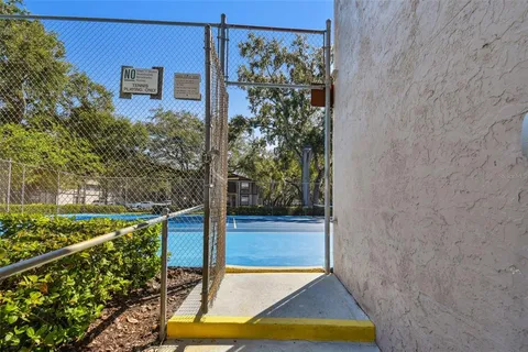 a view of a house with pool and a yard
