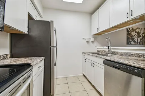 a kitchen with a stove microwave and refrigerator