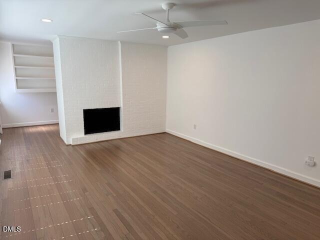 904 Brookwood Drive Raleigh, NC 27607 - Photo 7 of 12 a view of empty room with wooden floor and fan