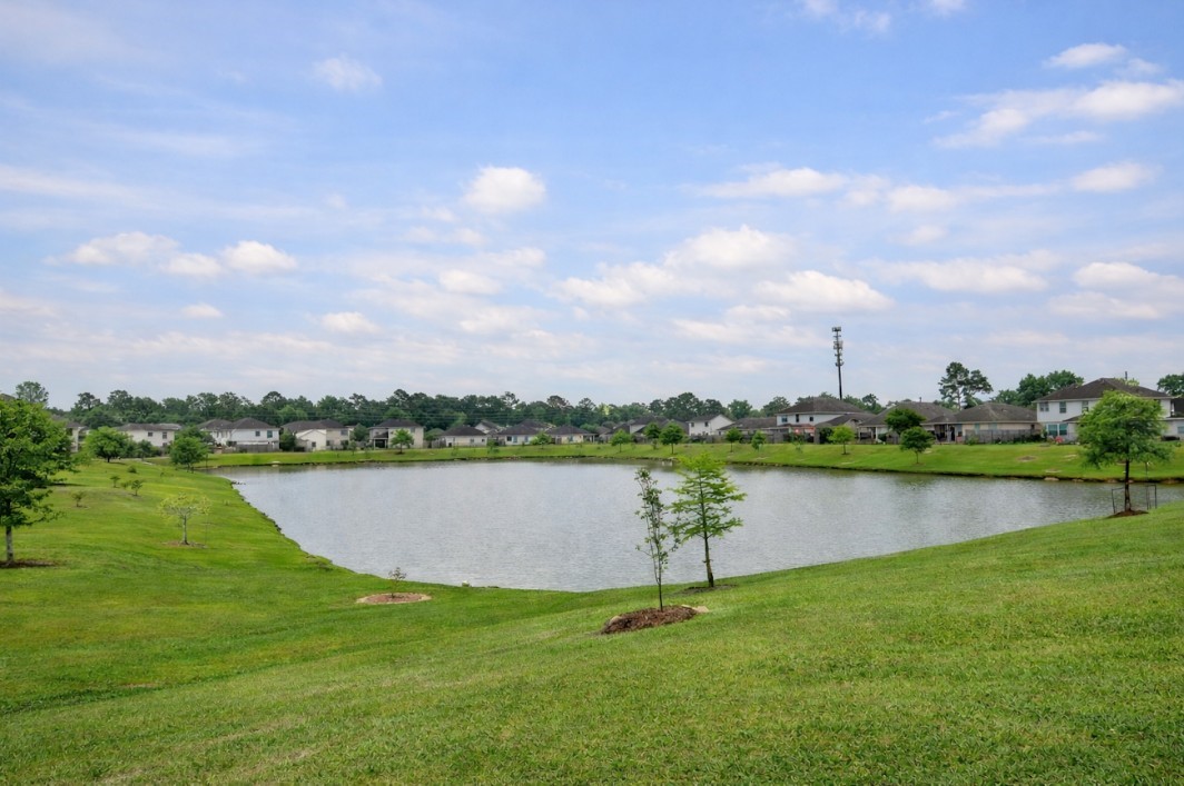 21530 Falvel Lake Drive Spring, TX 77388 - Photo 7 of 7 a view of a lake with a city view