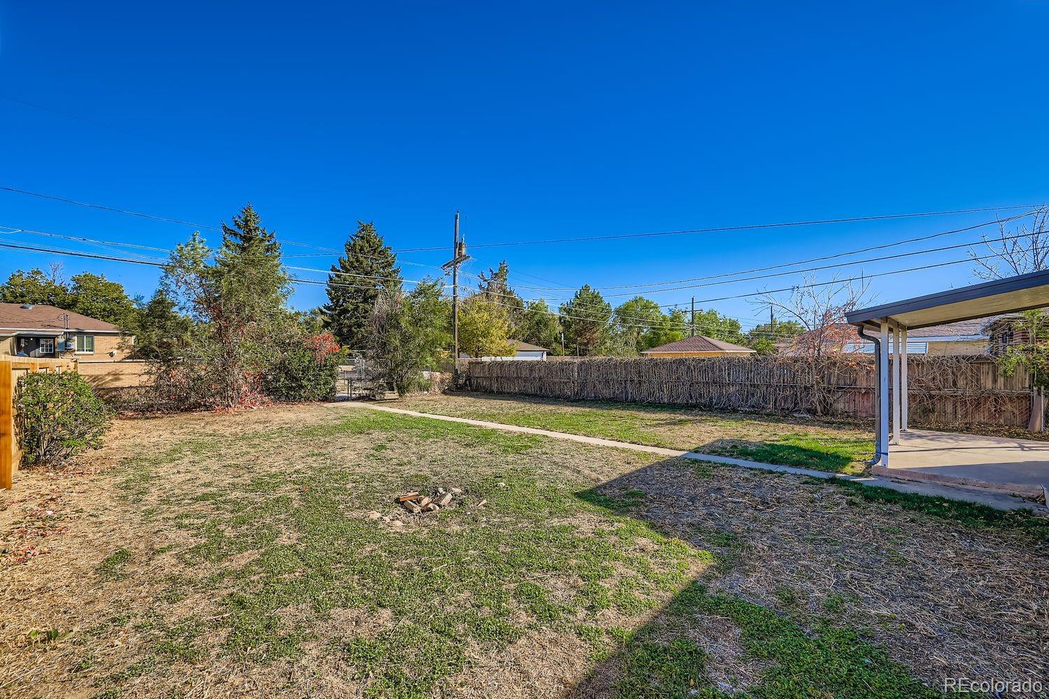 3690 Magnolia Street Denver, CO 80207 - Photo 14 of 17 a view of outdoor space with playground and green space