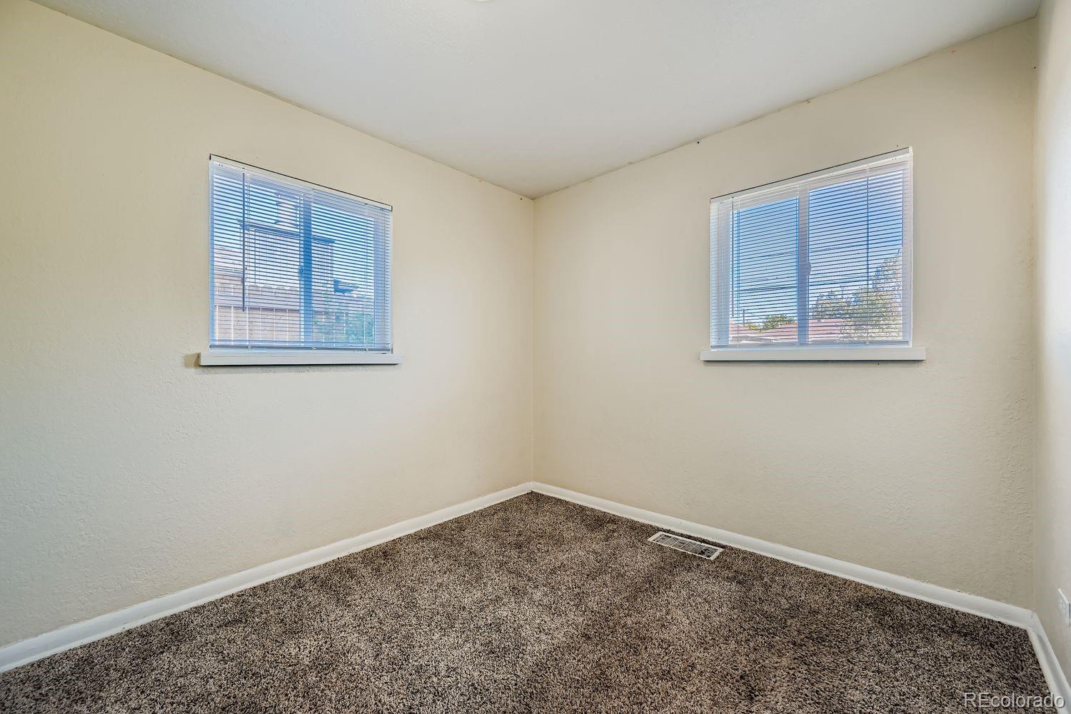 3690 Magnolia Street Denver, CO 80207 - Photo 9 of 17 a view of an empty room with a window