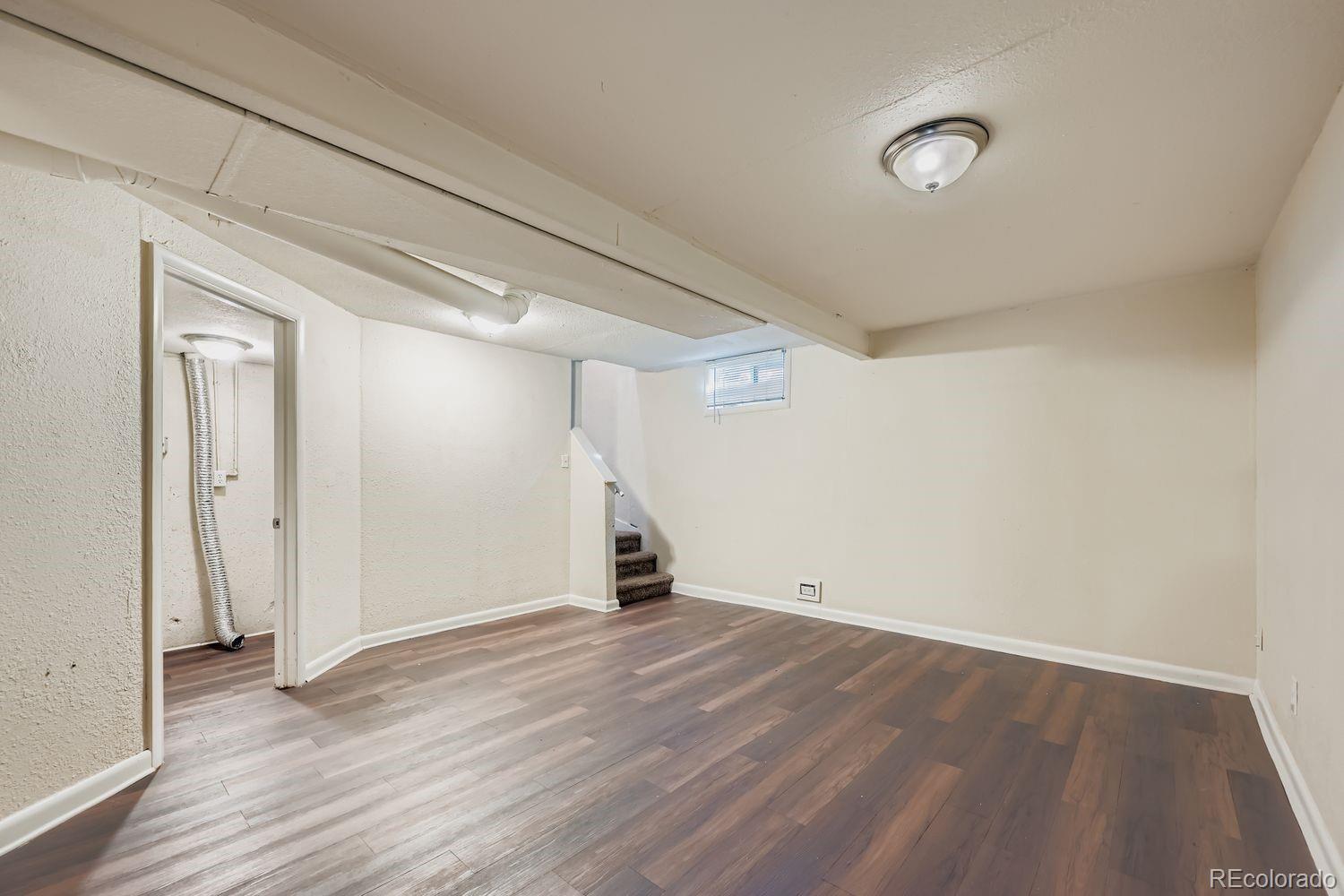 3690 Magnolia Street Denver, CO 80207 - Photo 10 of 17 wooden floor in an empty room