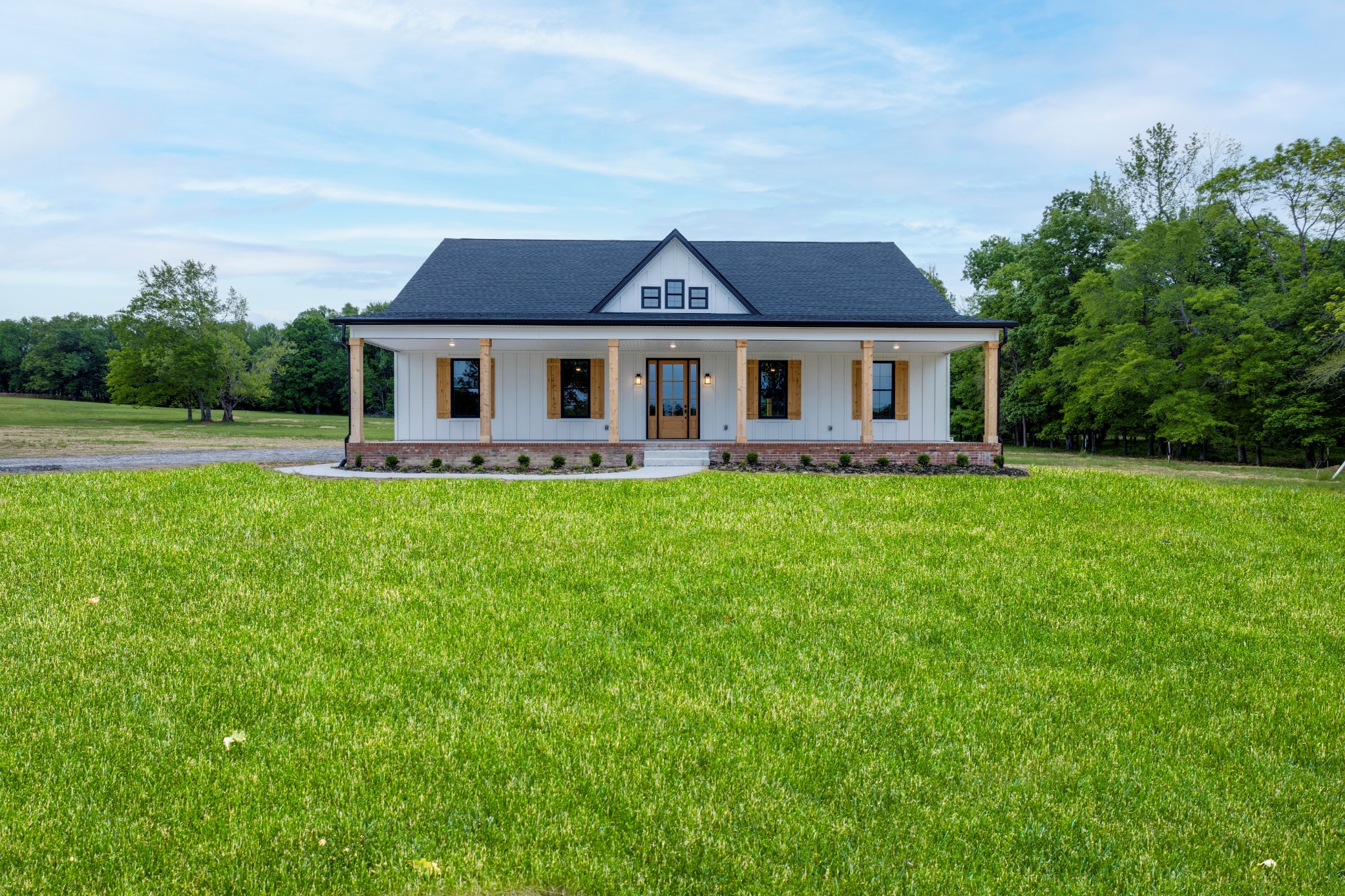 248 Dink Rut Road Portland, TN 37148 - Photo 1 of 41 a front view of a house with a yard and trees