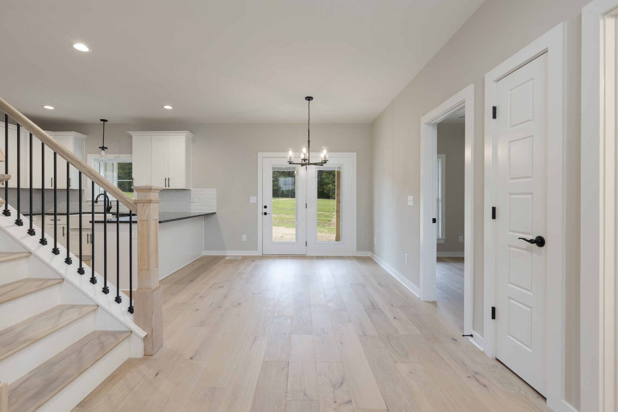 248 Dink Rut Road Portland, TN 37148 - Photo 14 of 41 a view of a hallway with wooden floor and staircase
