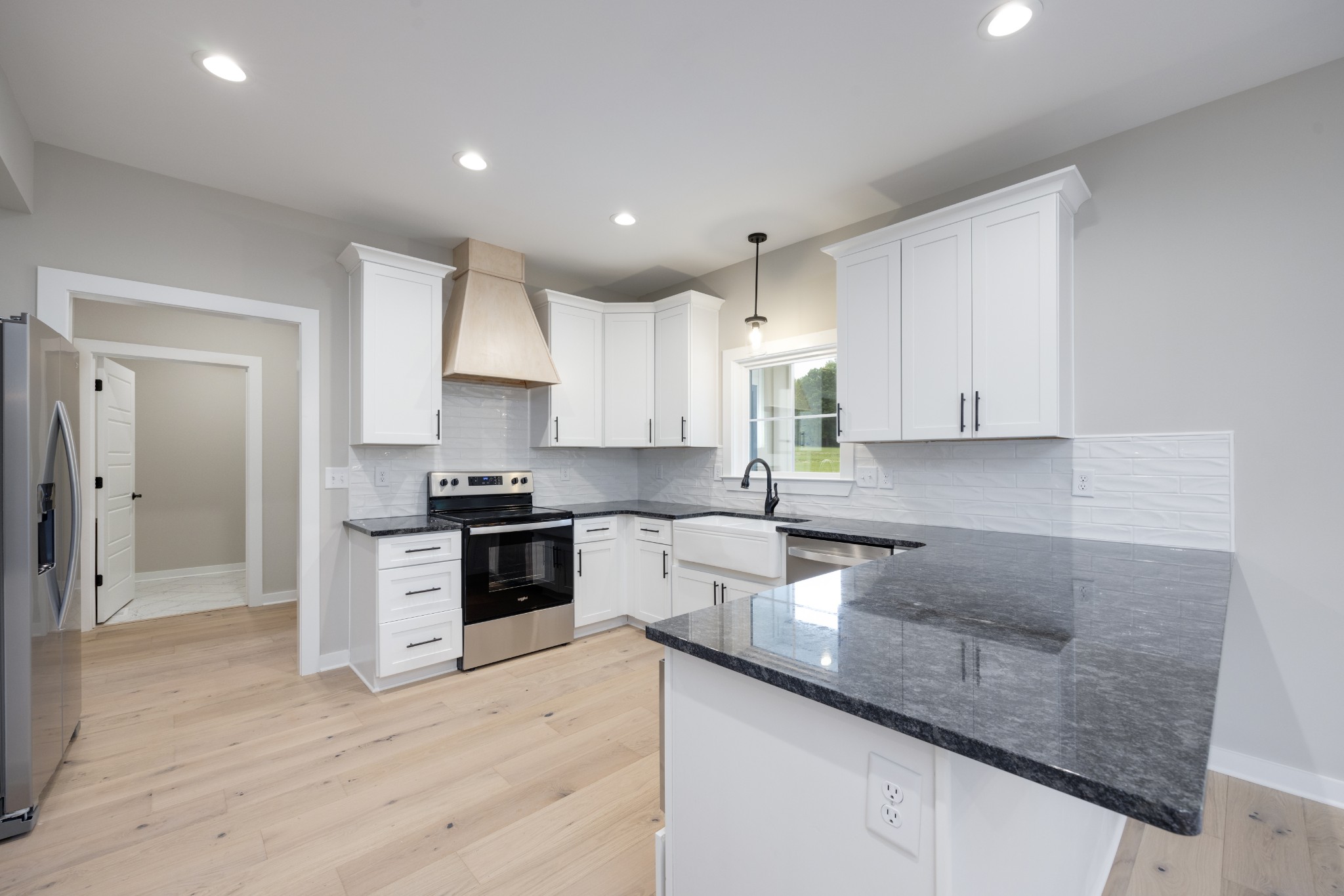 248 Dink Rut Road Portland, TN 37148 - Photo 17 of 41 a kitchen with a sink a counter top space stainless steel appliances and cabinets