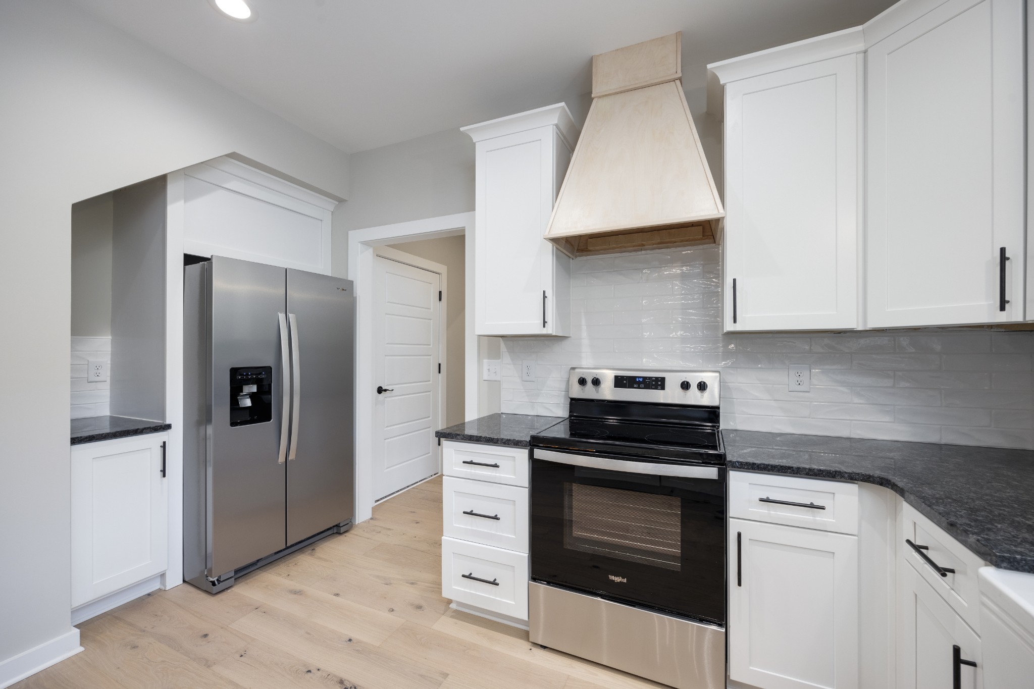 248 Dink Rut Road Portland, TN 37148 - Photo 19 of 41 a kitchen with stainless steel appliances granite countertop a stove and a refrigerator
