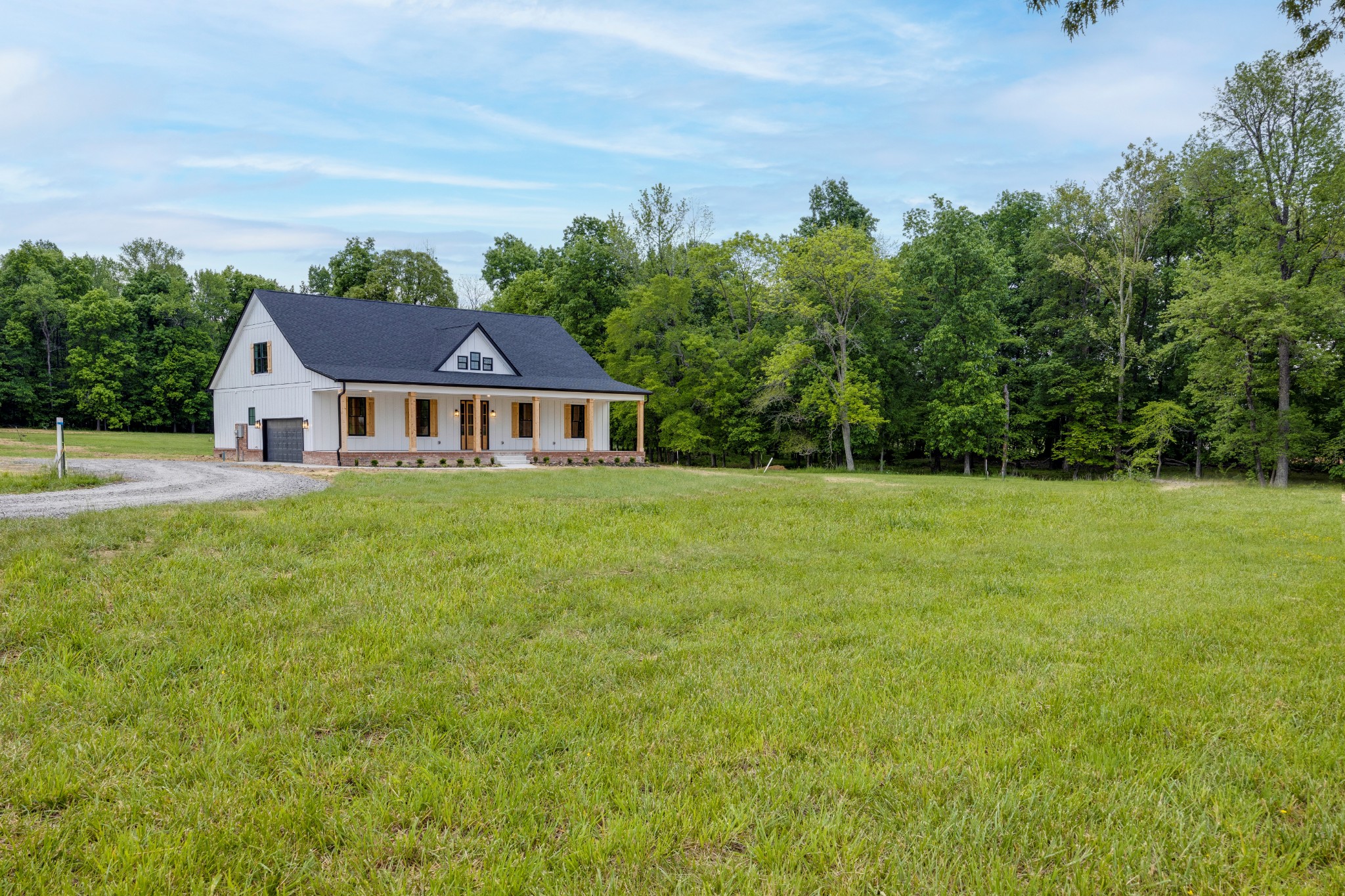 248 Dink Rut Road Portland, TN 37148 - Photo 3 of 41 a front view of a house with a yard