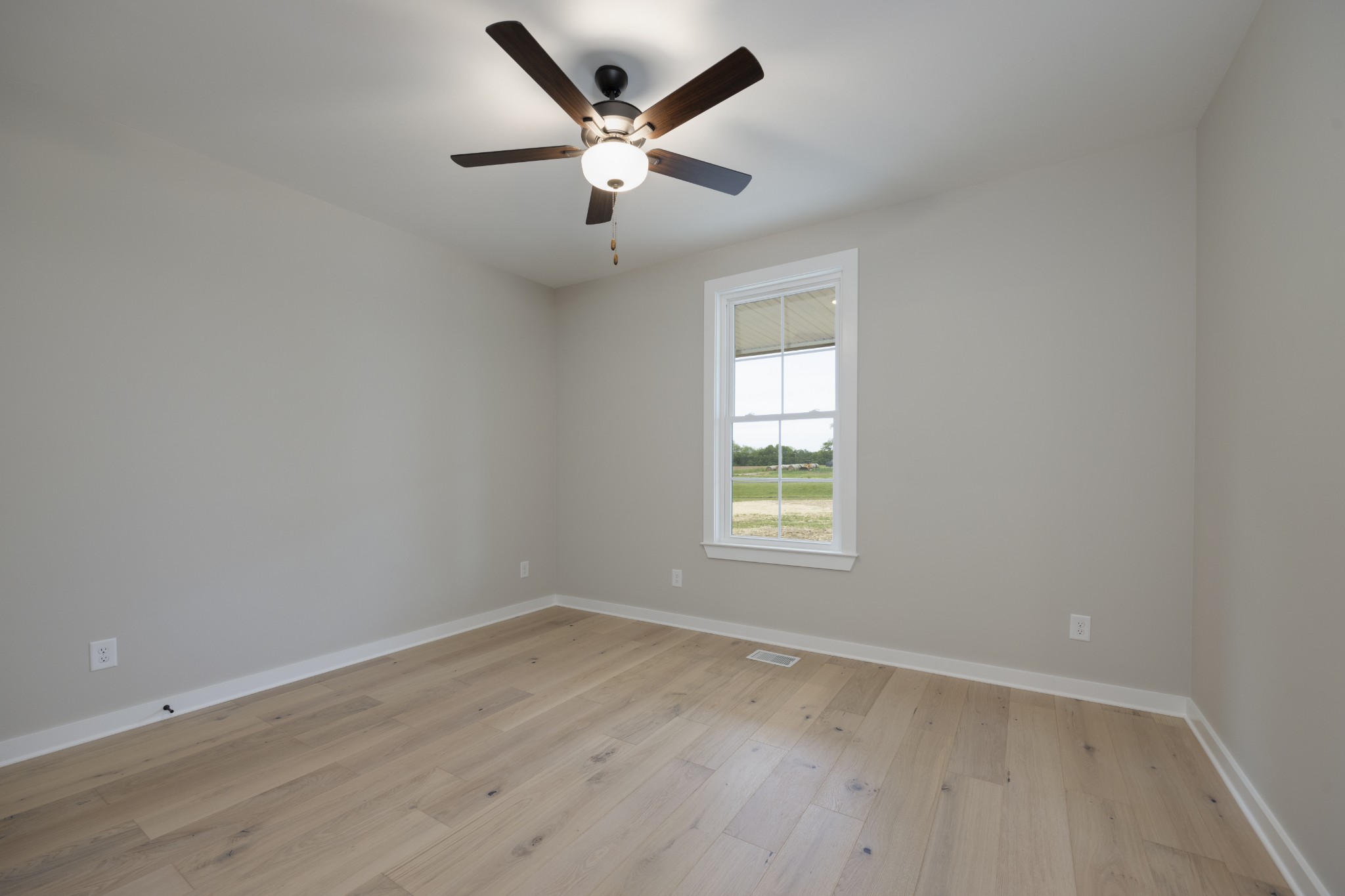 248 Dink Rut Road Portland, TN 37148 - Photo 31 of 41 an empty room with wooden floor and windows