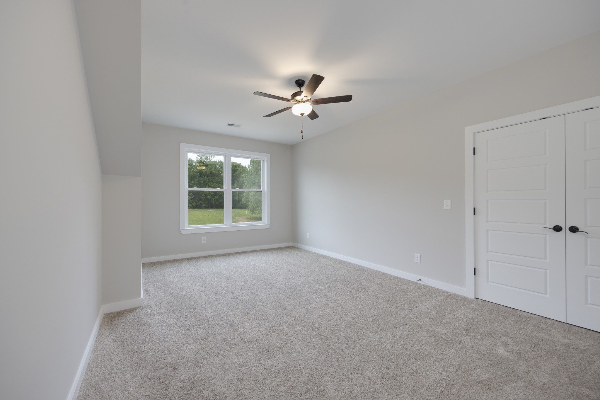 248 Dink Rut Road Portland, TN 37148 - Photo 33 of 41 a view of a room with a ceiling fan and a window