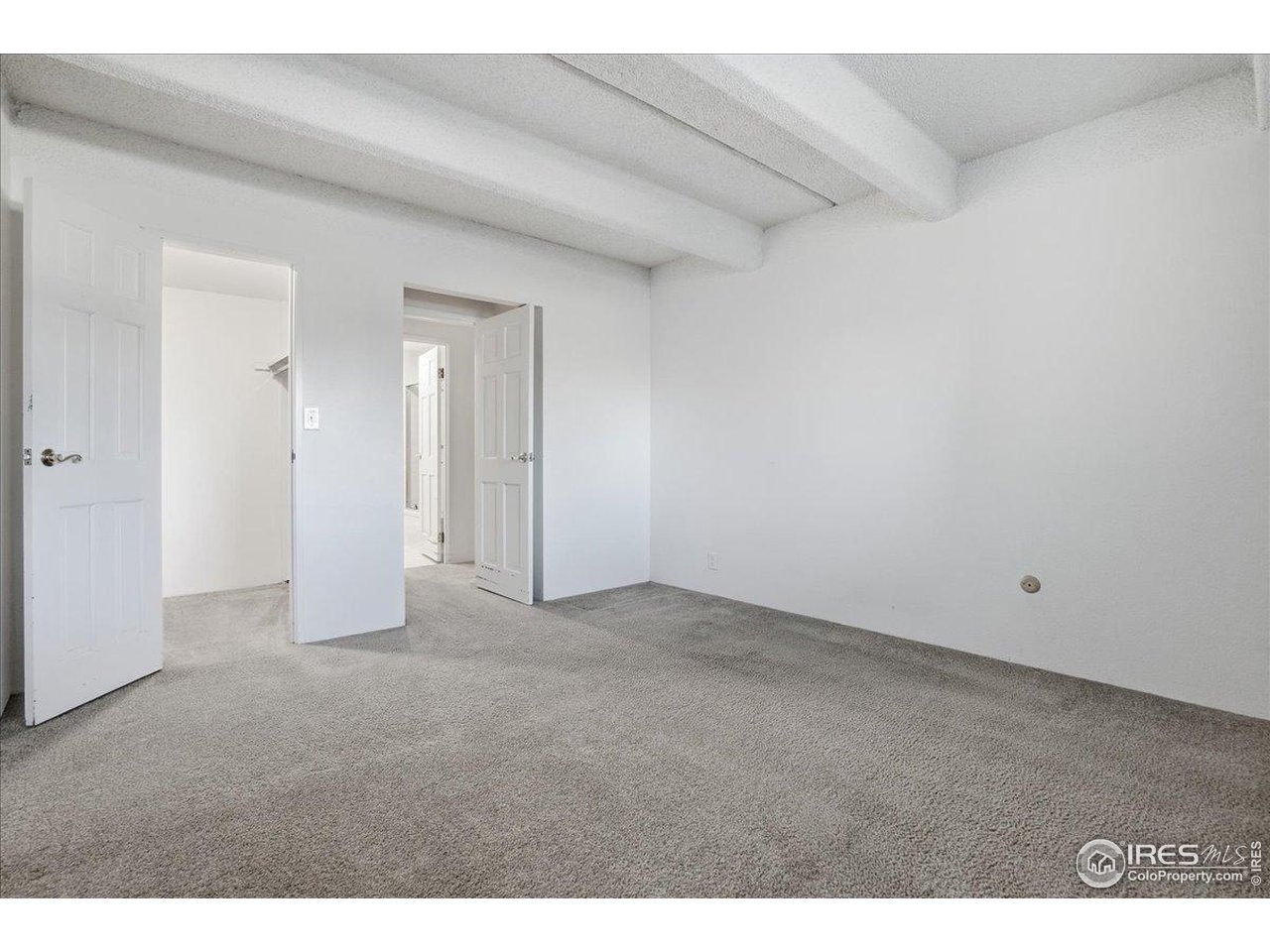 415 South Howes Street, Unit N206 Fort Collins, CO 80521 - Photo 17 of 48 a view of an empty room and closet