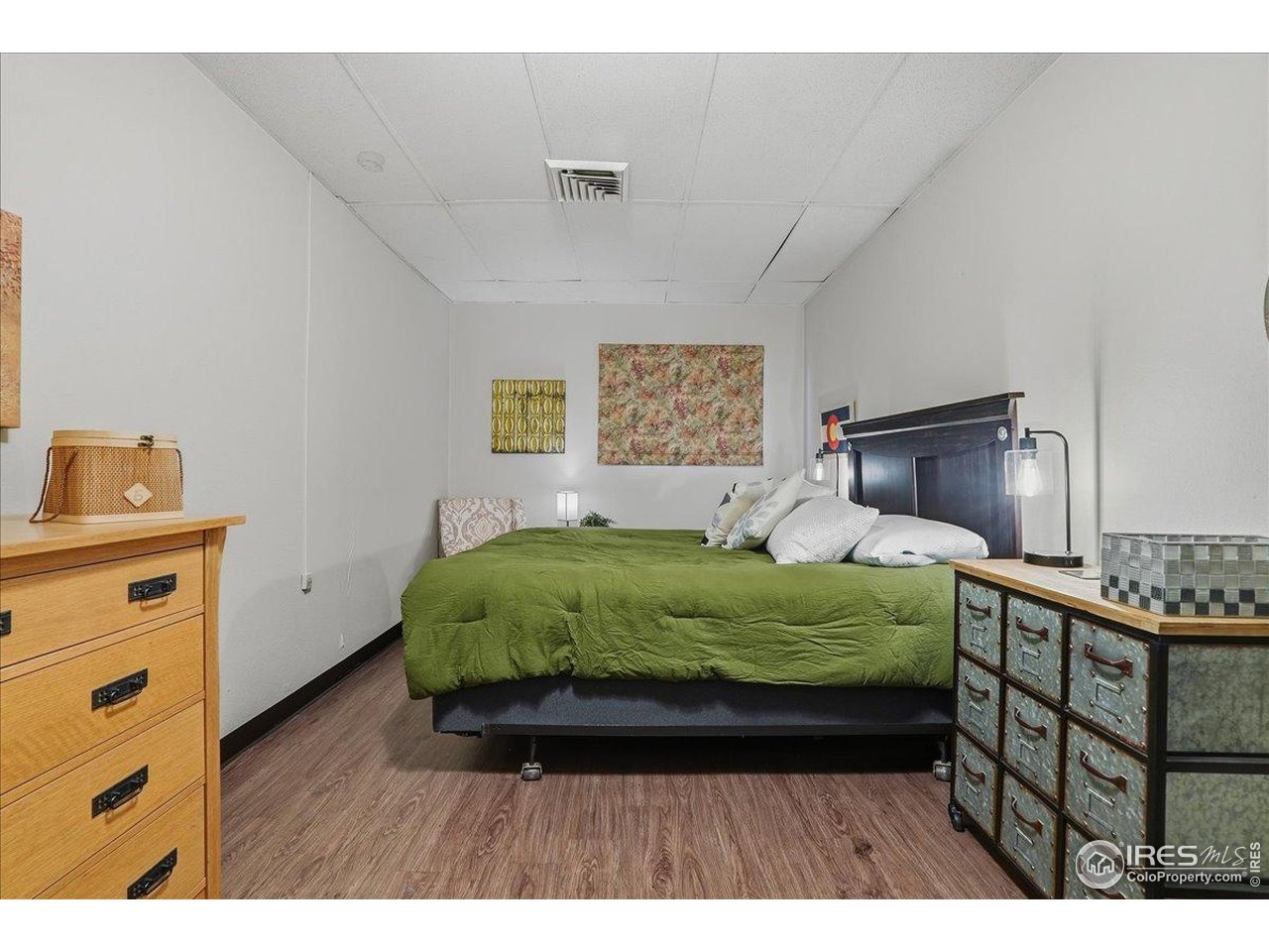 415 South Howes Street, Unit N206 Fort Collins, CO 80521 - Photo 35 of 48 a bed room with a bed and a dresser