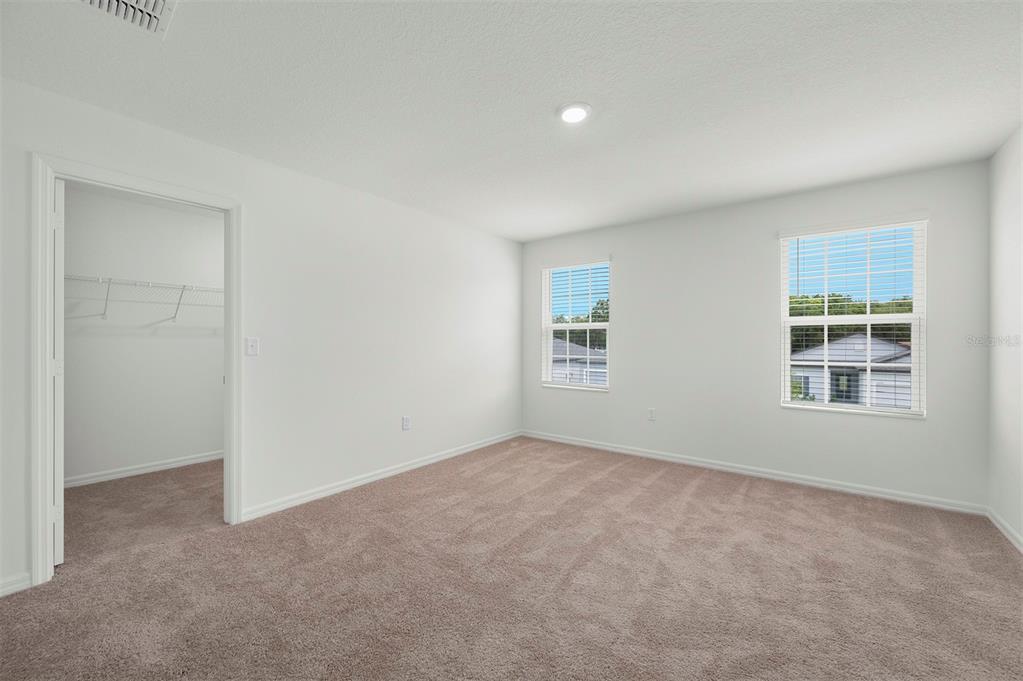 13291 Tula Loop Astatula, FL 34705 - Photo 12 of 22 an empty room with windows