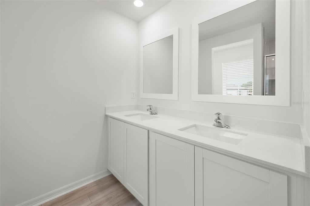 13291 Tula Loop Astatula, FL 34705 - Photo 14 of 22 a bathroom with a sink and a mirror