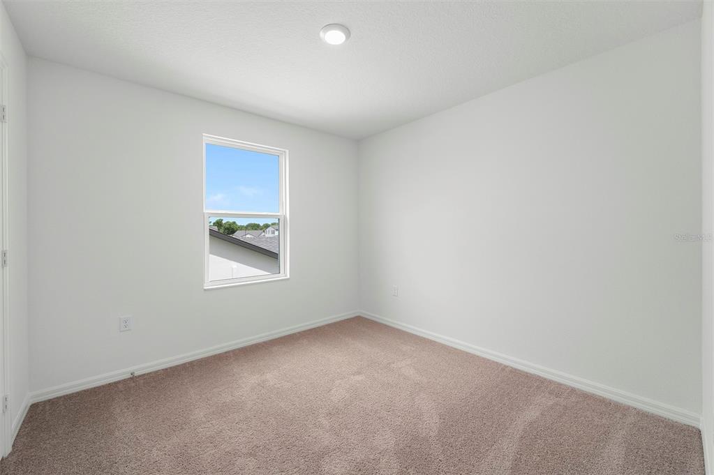 13291 Tula Loop Astatula, FL 34705 - Photo 17 of 22 an empty room with a window