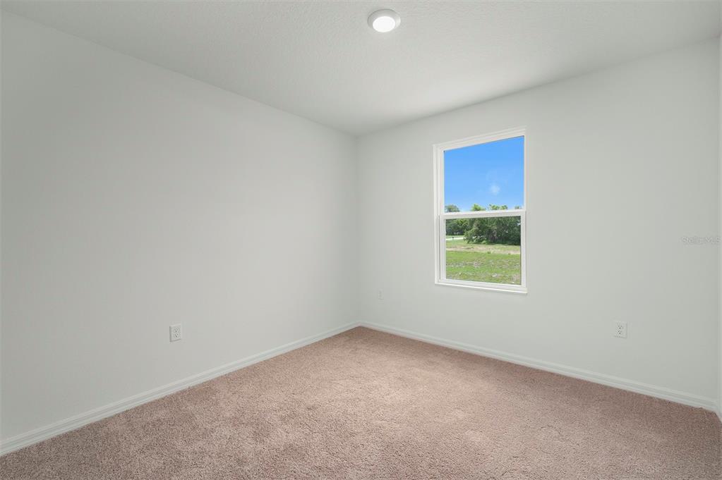 13291 Tula Loop Astatula, FL 34705 - Photo 18 of 22 an empty room with a window