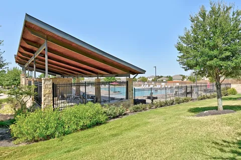 a backyard of a house with lots of green space