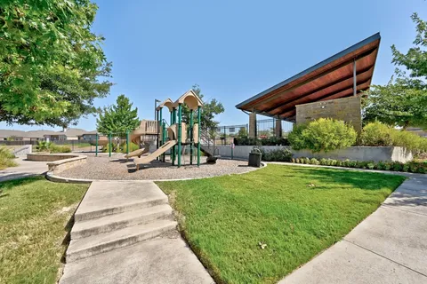 a view of a backyard with sitting area