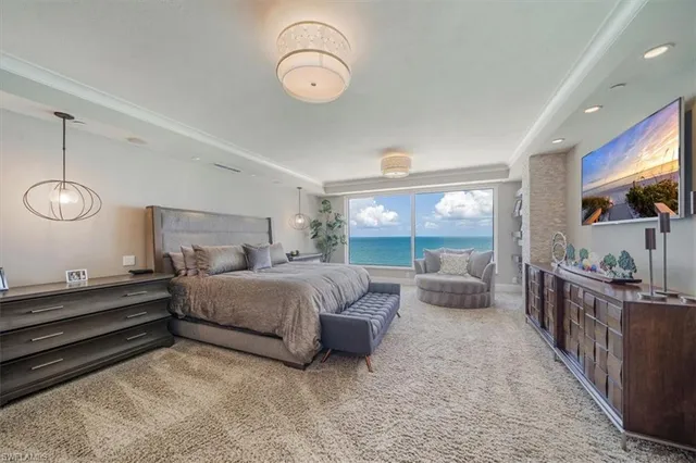 a bedroom with bed and a large window