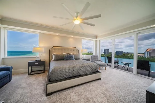 a bedroom with a bed chair and window