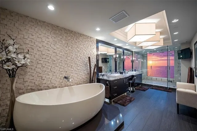 a bathroom with a bathtub and a sink
