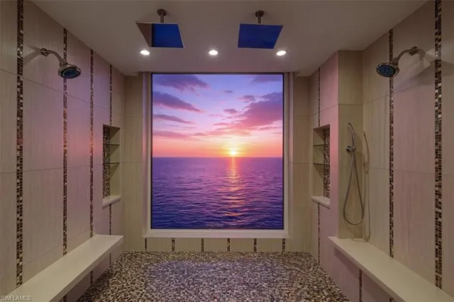 a bathroom with a glass shower door