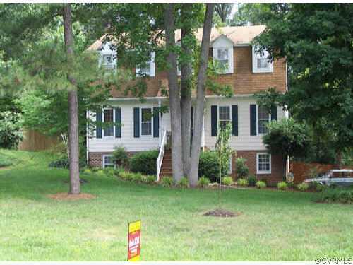 519 Walton Park Road Midlothian, VA 23114 - Photo 1 of 1 a front view of a house with a yard and tree