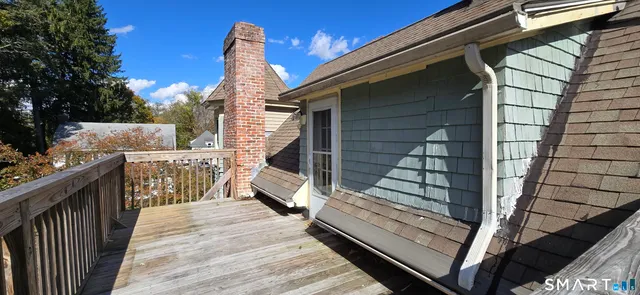 a view of outdoor space with deck and outdoor seating