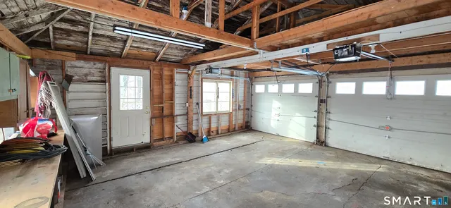 a view of a room with wooden walls