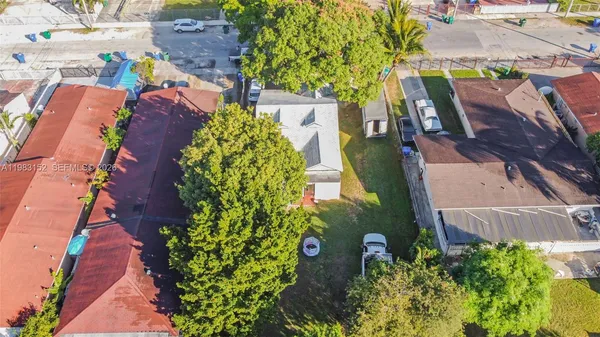 an aerial view of a houses with outdoor space