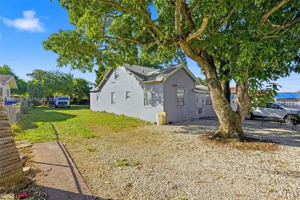 a house with a tree in front of it