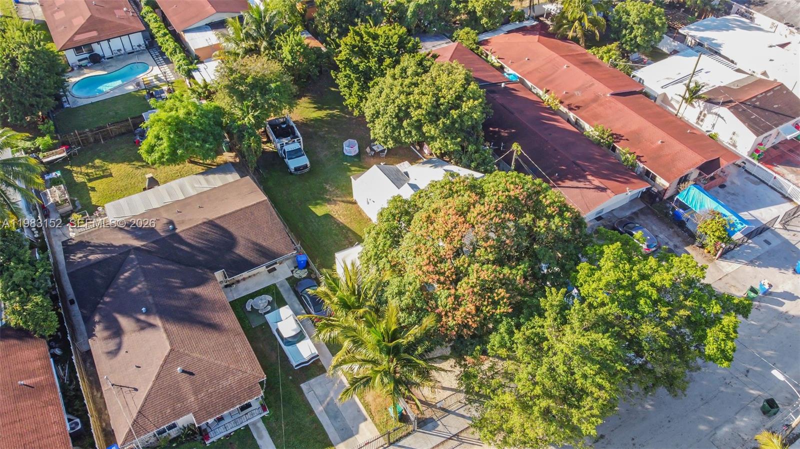 2142 Northwest 33rd Street Miami, FL 33142 - Photo 21 of 26 an aerial view of a house with a yard and garden