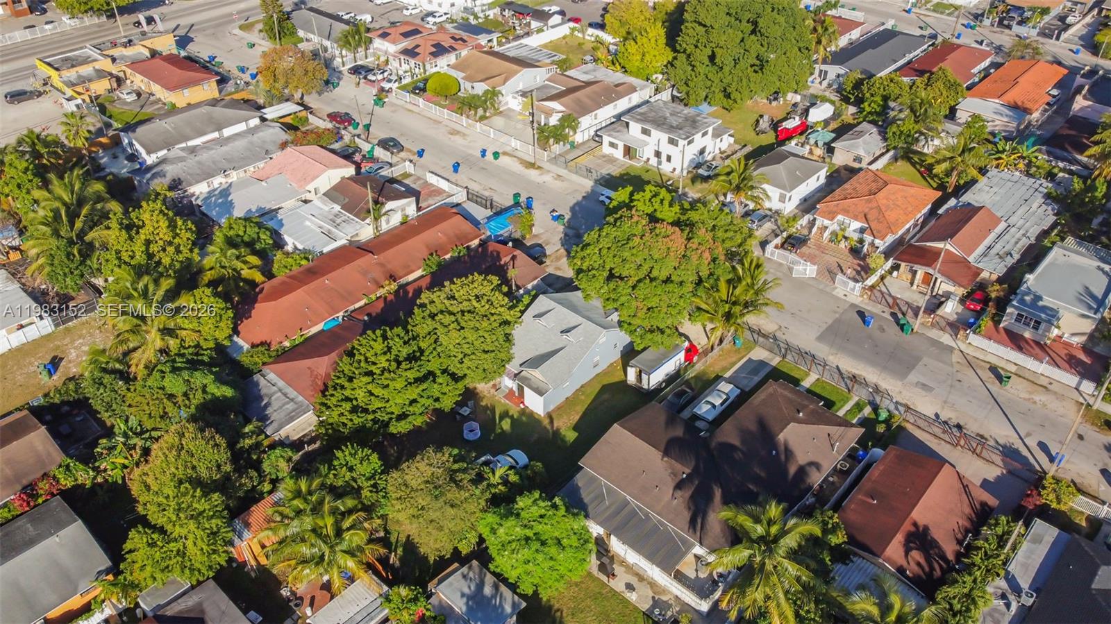 2142 Northwest 33rd Street Miami, FL 33142 - Photo 22 of 26 an aerial view of a house with a yard