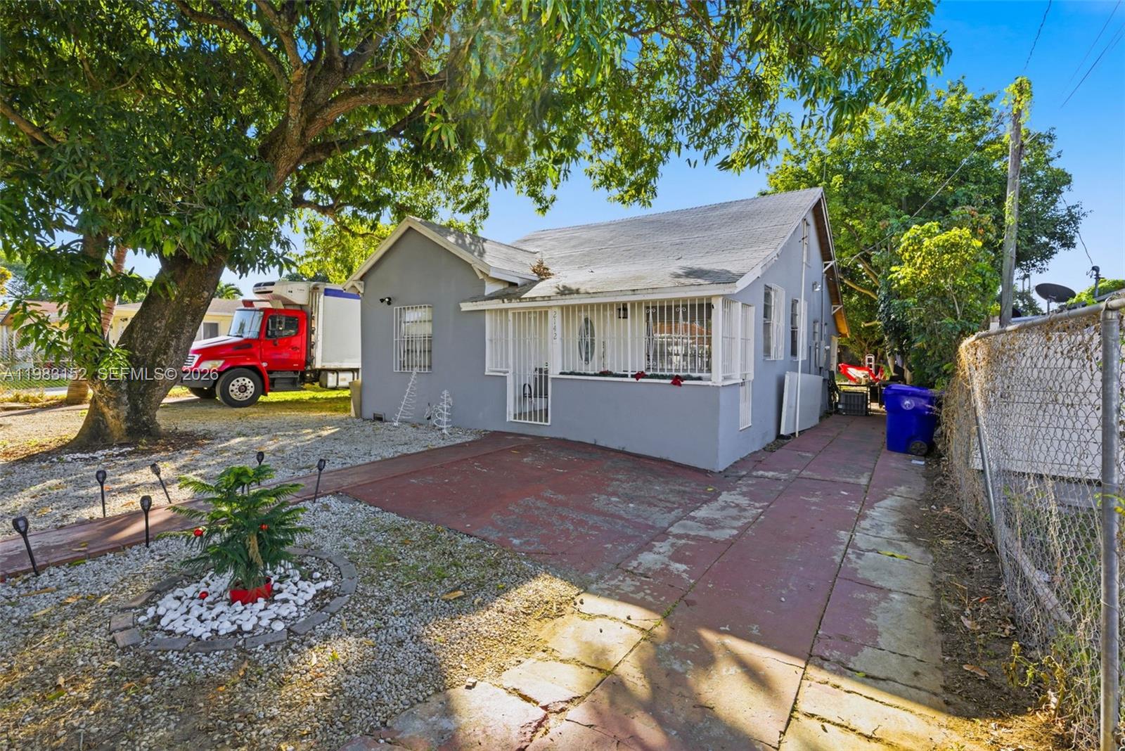 2142 Northwest 33rd Street Miami, FL 33142 - Photo 8 of 26 a house view with a backyard space