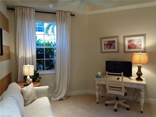 a workspace with furniture and a window