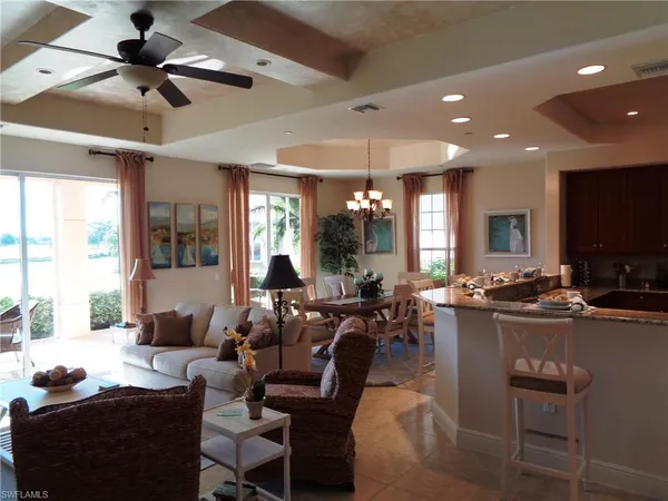 a living room with lots of furniture and a flat screen tv