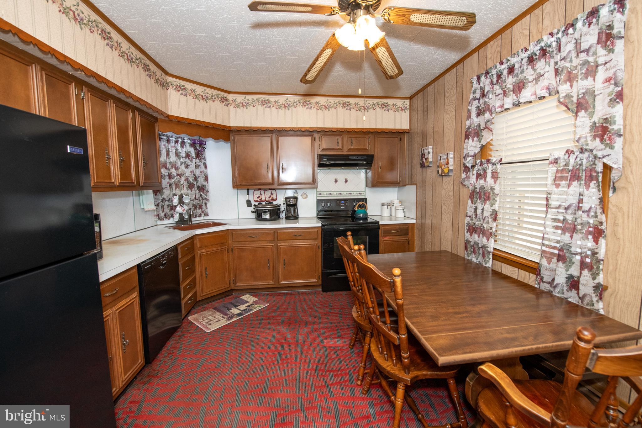2740 Pratt Street Philadelphia, PA 19137 - Photo 16 of 45 a kitchen with a table chairs and a chandelier