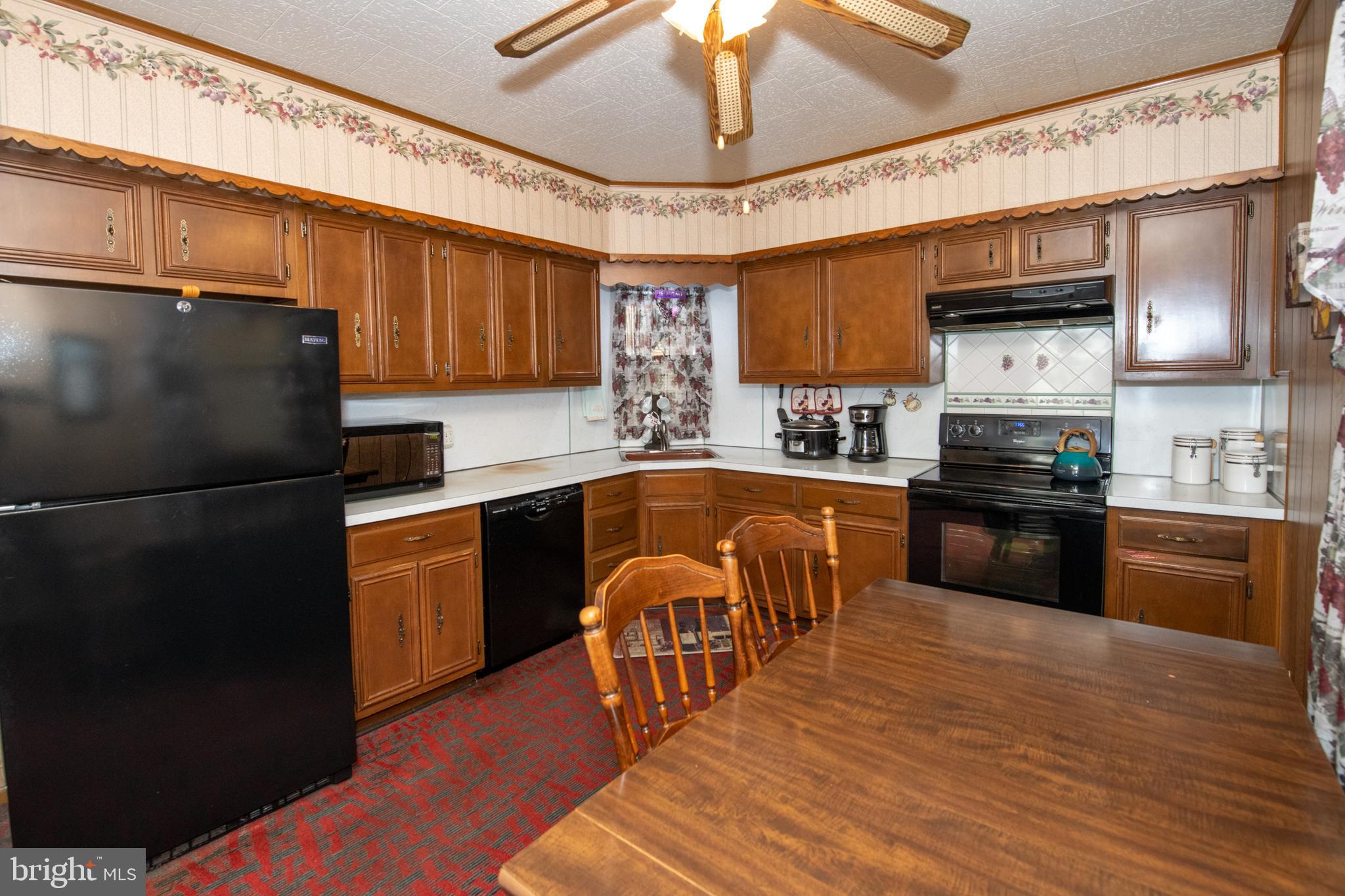 2740 Pratt Street Philadelphia, PA 19137 - Photo 17 of 45 a kitchen with granite countertop stainless steel appliances and wooden cabinets