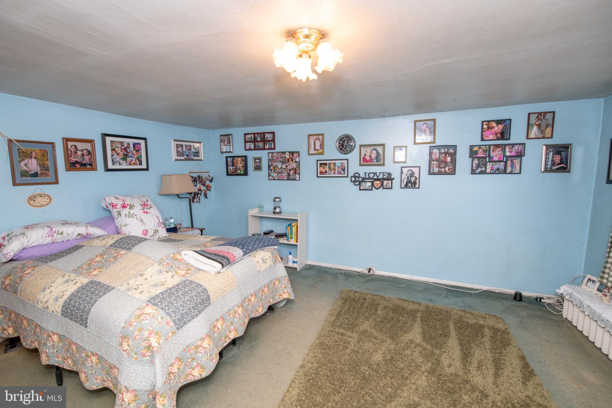 2740 Pratt Street Philadelphia, PA 19137 - Photo 22 of 45 a bedroom with a bed and a painting on the wall