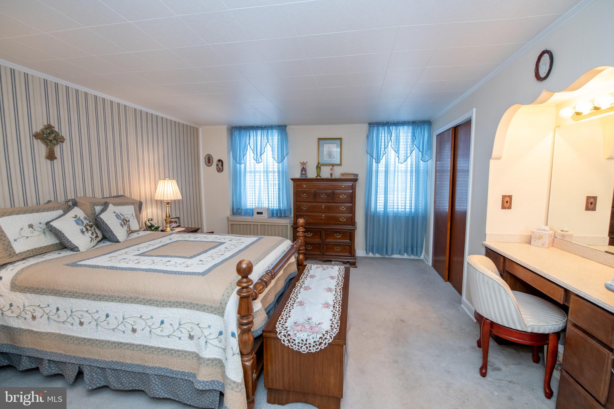 2740 Pratt Street Philadelphia, PA 19137 - Photo 24 of 45 a spacious bedroom with a bed and a table in it