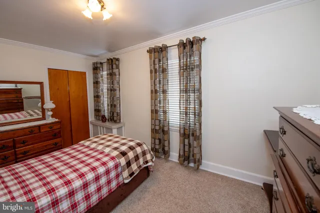 a bedroom with a bed and lamp