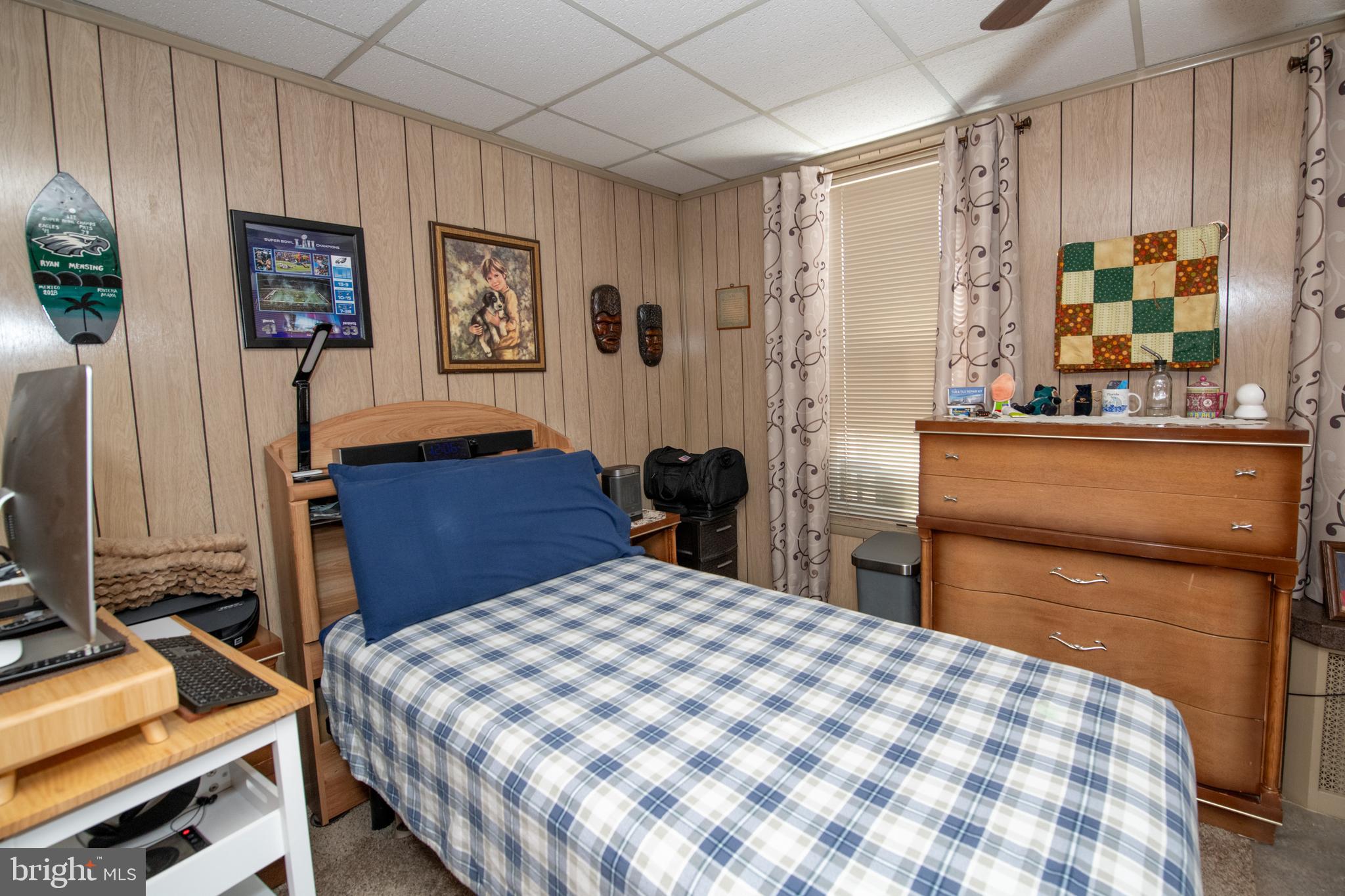 2740 Pratt Street Philadelphia, PA 19137 - Photo 31 of 45 a bedroom with a bed and dresser with mirror