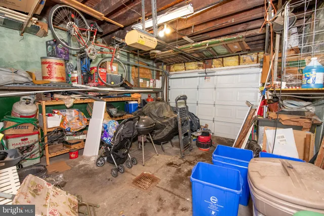 a view of a livingroom with lounge chair and a large window